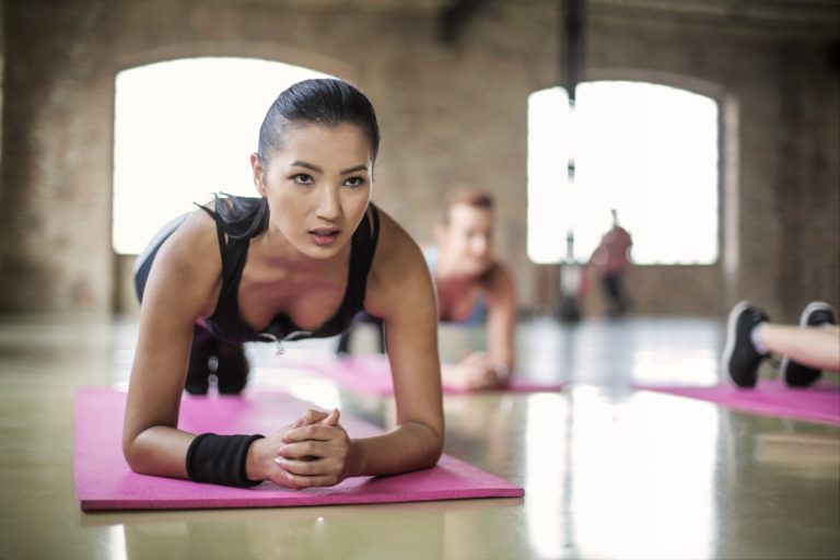 women-doing-a-yoga-on-yoga-mat-3775587