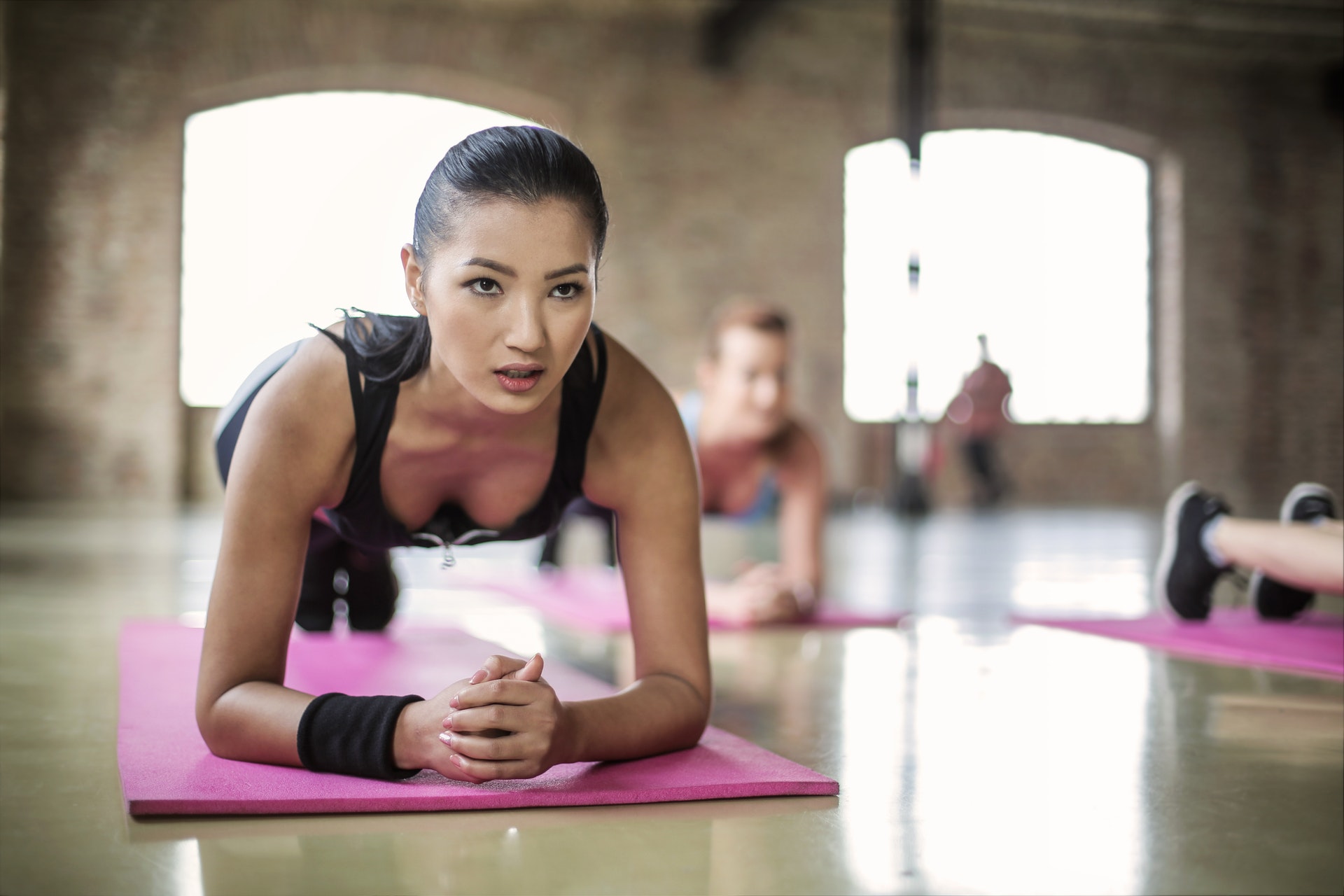 women-doing-a-yoga-on-yoga-mat-3775587